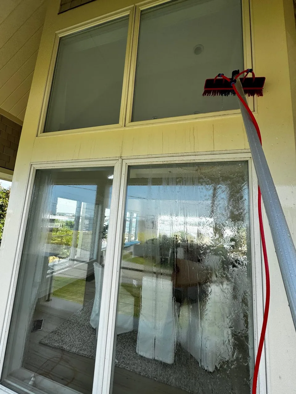 Water-fed pole cleaning exterior glass panels
